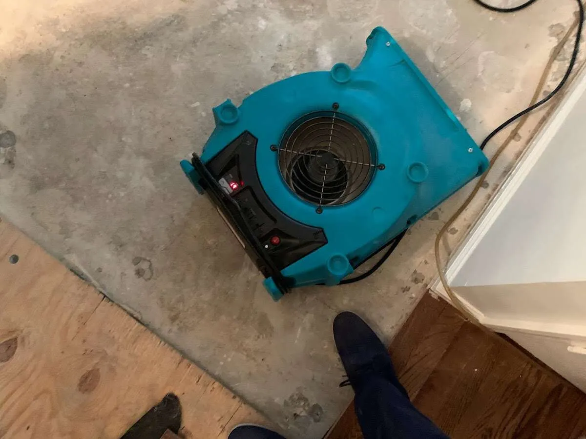 Air mover drying subfloor during Leak Detection & Repair in Weddington